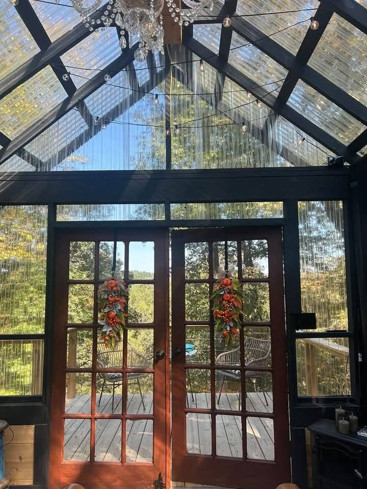 Inside The Glasshouse: French doors and a chandelier